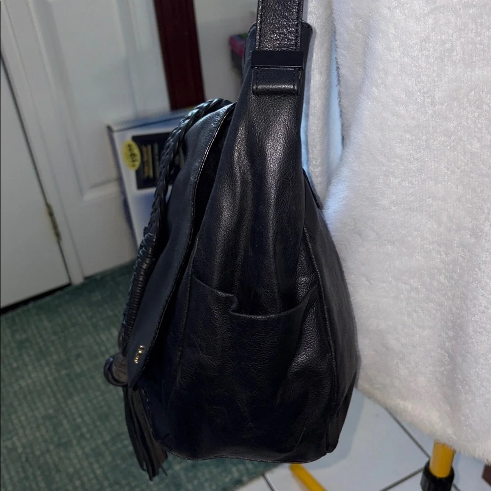 Elliott Lucca  shoulder bag  leather black  braiding & large tassel front  NWOT